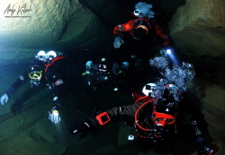 Divers in a cave in France by Andy Kutsch 